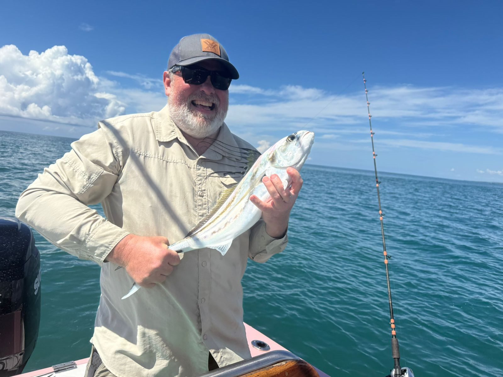 Experienced angler holding a quality inshore catch