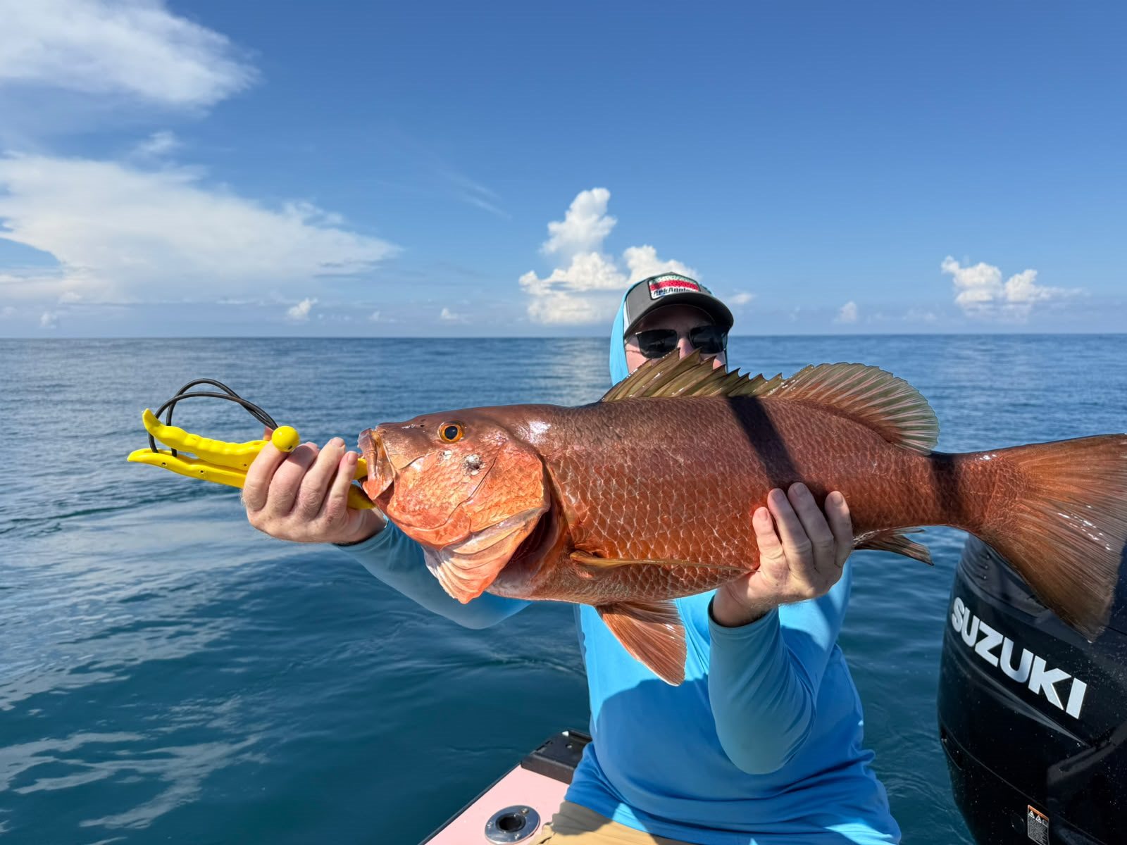 Angler holding a very large red snapper